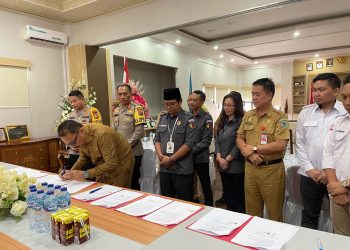 Bupati Bolmong Teken NPHD Pilkada 2024