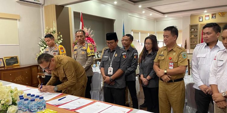 Bupati Bolmong Teken NPHD Pilkada 2024