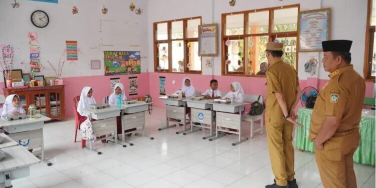 Iskandar-Deddy Tinjau Pendistribusian MBG di Kecamatan Bolaang Uki